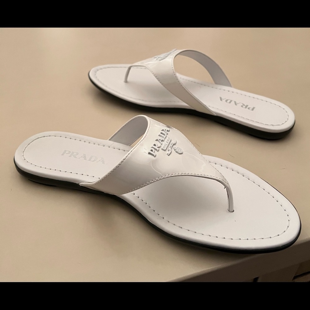 Prada white patent leather thong flip flop with rubber bottom. Size 39.5